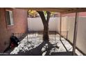 A covered patio features a mature tree and a fenced area at 15601 N 27Th St # 5, Phoenix, AZ 85032