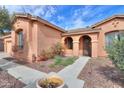 Inviting entrance featuring stone pathway and beautiful desert landscaping at 19973 N Monte Ln, Maricopa, AZ 85138