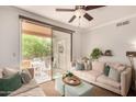 Comfortable living room with stylish furnishings and a sliding glass door to a private balcony at 20100 N 78Th Pl # 2210, Scottsdale, AZ 85255