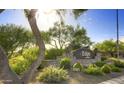 Entrance signage for The Edge at Grayhawk, beautifully landscaped with desert plants, cacti and flowering bushes at 20100 N 78Th Pl # 2210, Scottsdale, AZ 85255