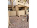 A view of the exterior showing the private entrance to a condo, with desert landscaping including stones and pavers at 2035 S Elm St # 114, Tempe, AZ 85282