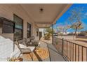 Cozy front porch with comfortable seating, small accents, and protection from the elements at 2320 E Harvard St, Phoenix, AZ 85006