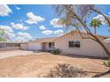 Attractive one-story home with a spacious driveway and minimal landscaping at 2359 W Del Oro Cir, Mesa, AZ 85202