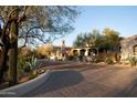 The warm tones of the stucco walls blend seamlessly with the surrounding desert flora at 23779 N 91St St, Scottsdale, AZ 85255