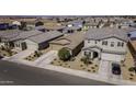 Aerial view of a residential neighborhood showcasing well-maintained homes and desert landscaping at 36602 W San Alvarez Ave, Maricopa, AZ 85138