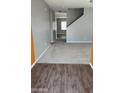 A bright entryway with light gray walls, neutral carpet, and wood-look flooring at 374 S Verdad Ln, Casa Grande, AZ 85194