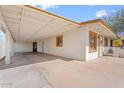 This angle captures the covered carport and the side of the home, highlighting its design and layout at 416 W Chambers St, Phoenix, AZ 85041