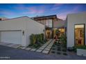 Beautiful home with a modern design, desert landscaping and a spacious garage at 5935 N Echo Canyon Ln, Phoenix, AZ 85018