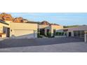 Beautiful home with a modern design, desert landscaping and a spacious garage at 5935 N Echo Canyon Ln, Phoenix, AZ 85018