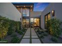 Inviting front entrance with stone walkway, lush landscaping and modern design at 5935 N Echo Canyon Ln, Phoenix, AZ 85018