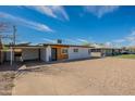 Charming single-story home with a carport and low-maintenance gravel landscaping at 829 W Mitchell Dr, Phoenix, AZ 85013