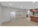 Open-concept living space with tile flooring and seamless flow to the kitchen at 8522 E Montebello Ave, Scottsdale, AZ 85250