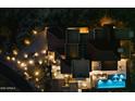 Aerial view of the property showcasing its unique roof design, outdoor amenities, and beautiful landscaping at 10585 E Crescent Moon Dr # 44, Scottsdale, AZ 85262