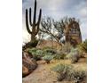 Four Seasons Resort entrance with native desert landscaping, including boulders, cacti, and desert shrubs at 10585 E Crescent Moon Dr # 44, Scottsdale, AZ 85262