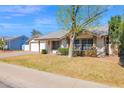 View of the house and garage on a well-maintained street at 1166 E Del Rio St, Chandler, AZ 85225