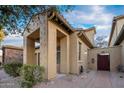 Architectural details highlight the front exterior with stucco columns and brick-paver pathway at 14257 W Harvard St, Goodyear, AZ 85395