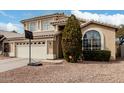 Two-story home featuring a neutral color scheme, two-car garage, tile roof, and well-maintained landscaping at 15618 N 12Th Ave, Phoenix, AZ 85023