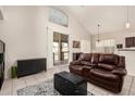 Inviting living room features high ceilings, neutral colors, and access to the outdoor patio at 15618 N 12Th Ave, Phoenix, AZ 85023