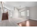 Expansive living area featuring stairs, and tile flooring, with lots of bright, natural light at 15618 N 12Th Ave, Phoenix, AZ 85023