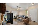 Comfortable living room with neutral colors, tile flooring, and lots of natural light at 16207 W Moreland St, Goodyear, AZ 85338