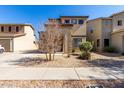 Charming two-story home with stone accents, a landscaped front yard, and a covered entry at 17445 N 185Th Dr, Surprise, AZ 85374