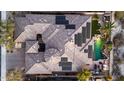 Aerial view of the roof, solar panels and the pool and outdoor space at 18059 W Ocotillo Ave, Goodyear, AZ 85338