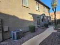 Home exterior featuring well-kept shrubs and trees around a clean walkway at 2150 E Bell Rd # 1048, Phoenix, AZ 85022