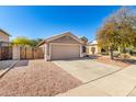 Single story home with a two-car garage and low maintenance gravel landscaping at 23402 N 22Nd Way, Phoenix, AZ 85024