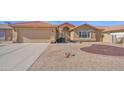 Exterior view showcasing desert landscaping and a tile roof at 25822 S Eastlake Dr, Sun Lakes, AZ 85248