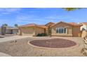 Charming single-story home showcasing desert landscaping and a Spanish tile roof at 25822 S Eastlake Dr, Sun Lakes, AZ 85248