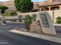 Gated community entrance with 'Village at South Mountain' sign, offering security and exclusivity at 3212 E Constance Way, Phoenix, AZ 85042