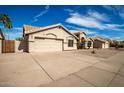 Desert home with a two car garage, low-maintenance front yard and a charming beige paint scheme at 3602 W Barcelona Dr, Chandler, AZ 85226