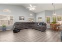 Bright open concept living room featuring vaulted ceilings, neutral walls, and wood laminate flooring at 3602 W Barcelona Dr, Chandler, AZ 85226