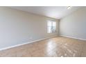 Inviting bedroom with ample natural light and tile flooring at 5125 W Wikieup Ln, Glendale, AZ 85308