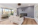 Cozy living room with a fireplace, sliding glass doors, and comfortable seating for relaxation at 6012 E Vernon Ave, Scottsdale, AZ 85257