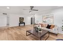 Spacious living room with modern furniture, wood floors, and neutral colors for a clean aesthetic at 6012 E Vernon Ave, Scottsdale, AZ 85257