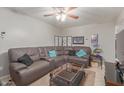 Comfortable living room featuring a plush sectional sofa and a stylish glass coffee table at 113 N Ridge Cir, Mesa, AZ 85203