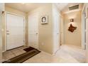 Inviting entryway with neutral tones and a decorative welcome mat for a warm greeting at 14950 W Mountain View Blvd # 4103, Surprise, AZ 85374