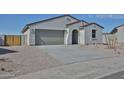 Charming single-Gathering home featuring a two-car garage and low maintenance desert landscaping at 1902 S 246Th Ln, Buckeye, AZ 85326