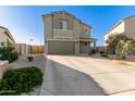 Two-story home featuring a two-car garage and a spacious driveway at 22962 N 182Nd Ln, Surprise, AZ 85387