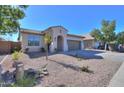 Attractive single-story house displaying low-maintenance desert landscaping and a spacious driveway leading to a two-car garage at 2393 E San Gabriel Trl, Casa Grande, AZ 85194