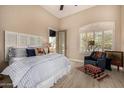 Cozy main bedroom with neutral tones, shuttered windows, and private outdoor access at 2924 W Here To There Dr, Phoenix, AZ 85086