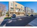 Modern townhomes showcasing private garages, balconies and manicured landscaping at 300 N Gila Springs Blvd # 164, Chandler, AZ 85226