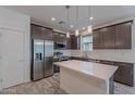 Modern kitchen with stainless steel appliances, island and custom cabinets at 300 N Gila Springs Blvd # 164, Chandler, AZ 85226