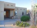 Inviting home exterior with a charming desert landscape, lovely fountain, and Southwestern design elements at 3007 W Jordon Ln, Phoenix, AZ 85086