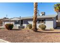 Charming single-story home with gray painted brick and low-maintenance landscaping at 3614 W Georgia Ave, Phoenix, AZ 85019