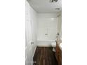 Bathroom featuring wood look floors, a shower and tub combination, and a vanity at 3810 N Maryvale Pkwy # 1089, Phoenix, AZ 85031