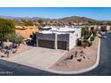 Aerial shot of a Southwestern-style home showcasing its desert landscaping and surrounding neighborhood at 4309 S Priceless View Dr, Gold Canyon, AZ 85118