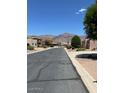 Desert street view showcasing well-maintained roads and desert landscaping under a clear sky with mountain views at 4309 S Priceless View Dr, Gold Canyon, AZ 85118