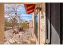 Cozy balcony features outdoor seating with view of neighborhood and the Arizona sky at 455 S Delaware Dr # 106, Apache Junction, AZ 85120